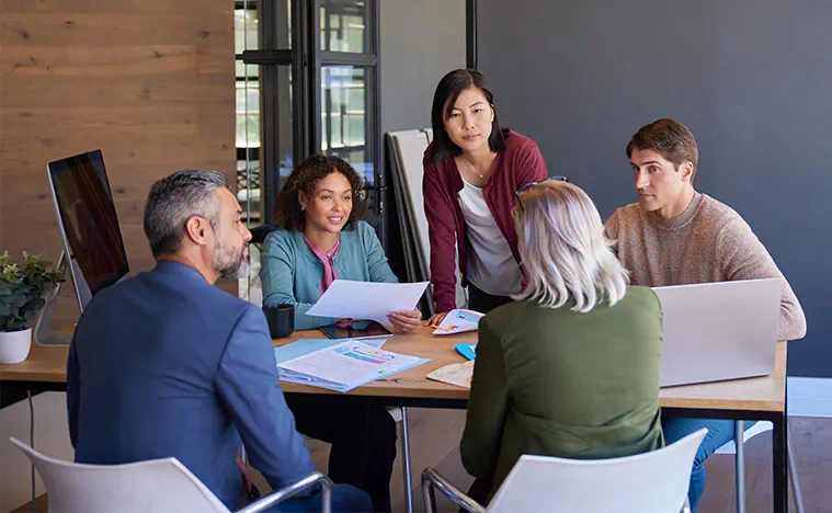 A consultation between business people in a conference room.